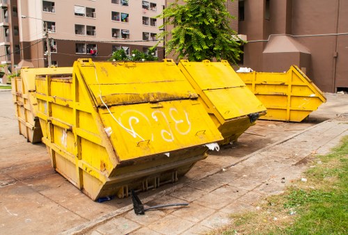 Construction site with builders managing waste